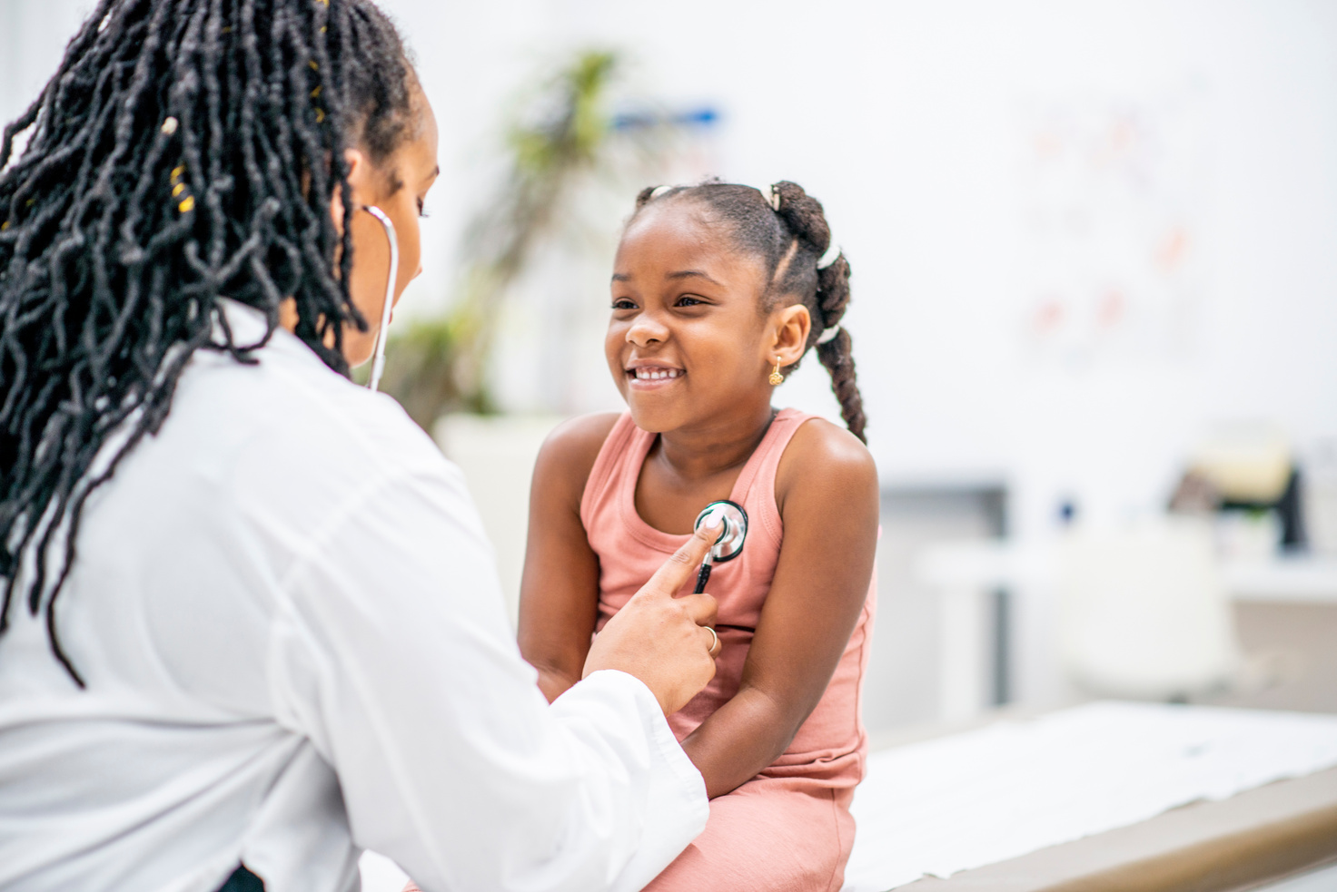 Pediatric Gastroenterology. A young individual is being examined by a doctor